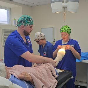 Nursing staff at the YFH helping to bandage up a patienst foot post surgery