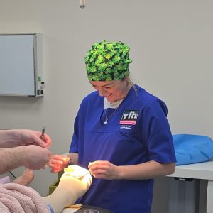 Sally, the nurse, supports the patient